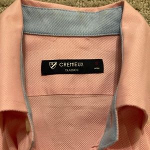 Pink button down with light blue cuffs.